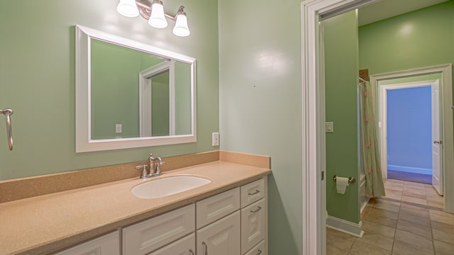 bathroom with tile floors and large vanity