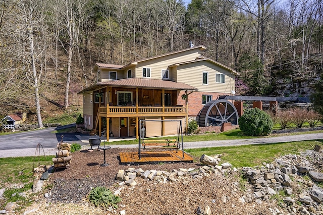 view of property featuring a front lawn