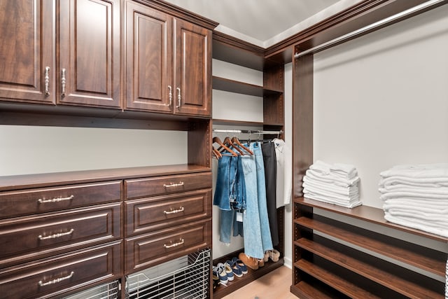 walk in closet featuring light wood-type flooring