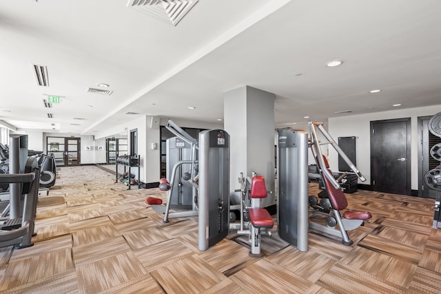 gym featuring light carpet