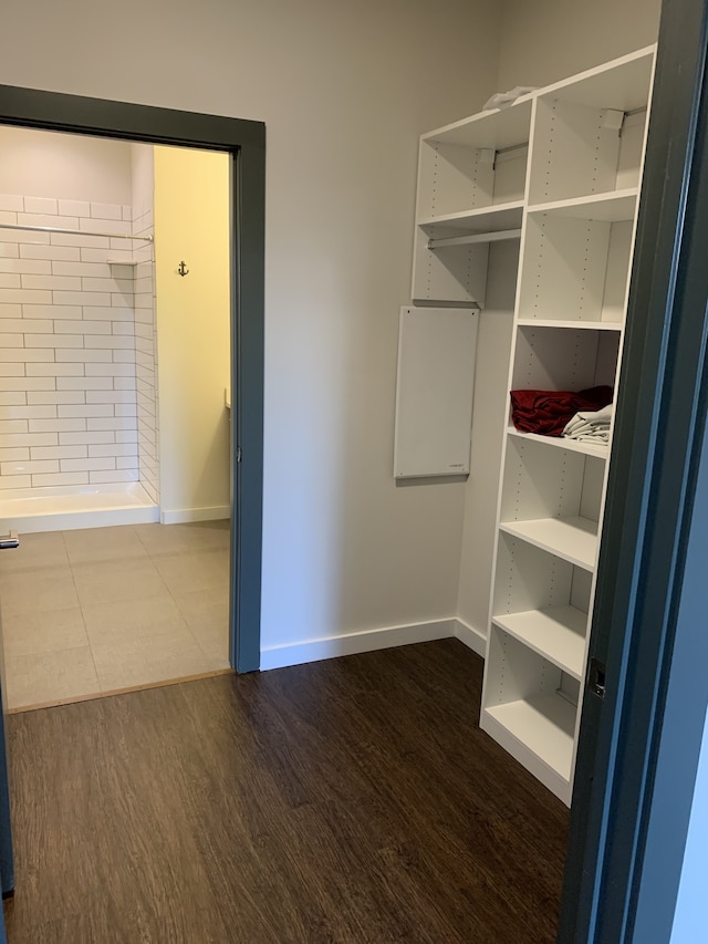 1900 12th Ave S Unit 313, Nashville, TN 37203 - walk in closet featuring hardwood / wood-style flooring