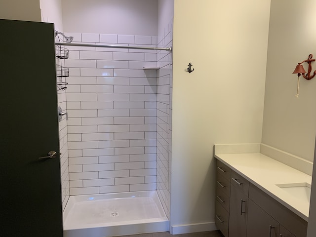 1900 12th Ave S Unit 313, Nashville, TN 37203 - bathroom featuring vanity and tiled shower