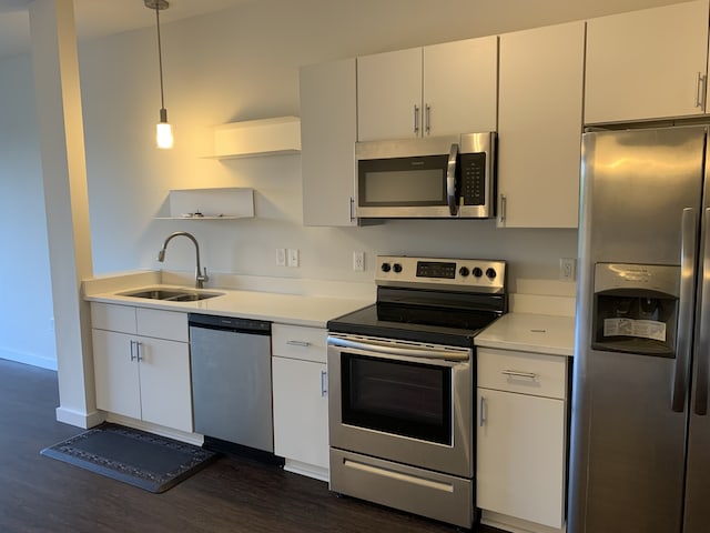 1900 12th Ave S Unit 313, Nashville, TN 37203 - kitchen featuring dark hardwood / wood-style flooring, white cabinetry, sink, and stainless steel appliances