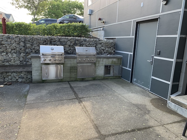 1900 12th Ave S Unit 313, Nashville, TN 37203 - view of patio / terrace featuring a grill and area for grilling