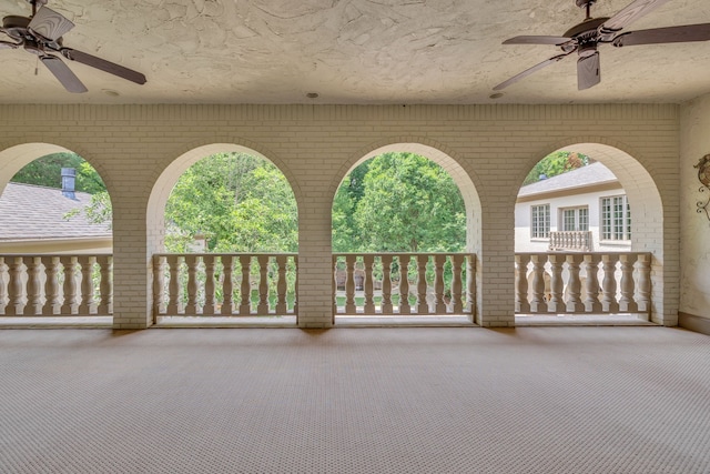 view of patio featuring ceiling fan