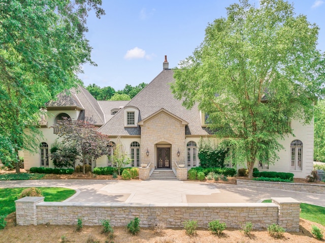 french country inspired facade with french doors