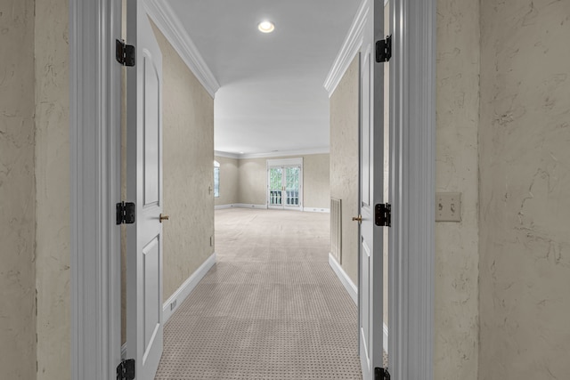 hallway featuring light carpet and crown molding