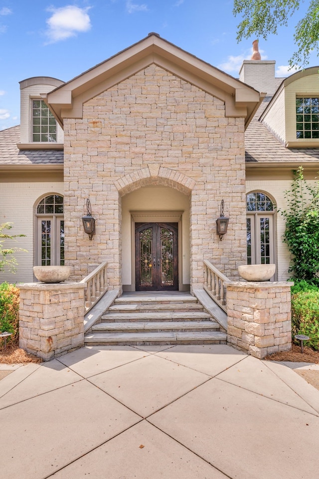 entrance to property featuring french doors