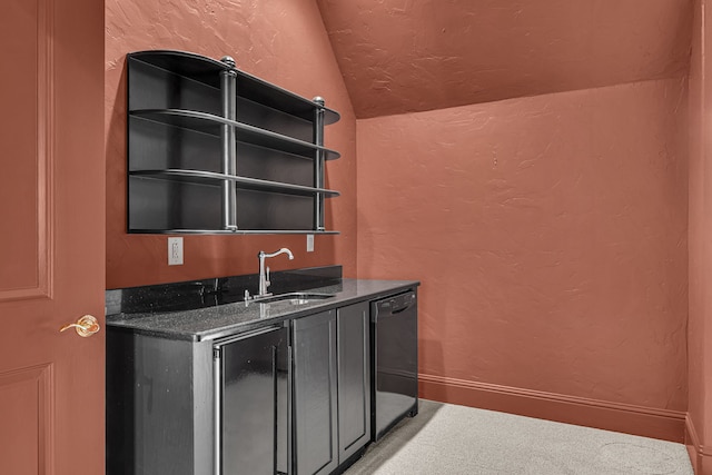 bar with lofted ceiling, carpet floors, dishwasher, sink, and dark stone counters