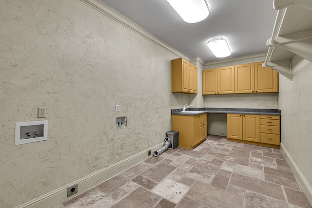 washroom featuring sink, crown molding, washer hookup, electric dryer hookup, and cabinets