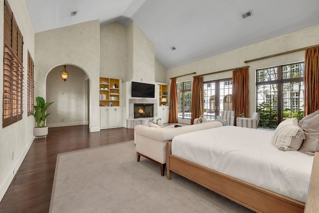 bedroom with high vaulted ceiling, dark wood-type flooring, and french doors