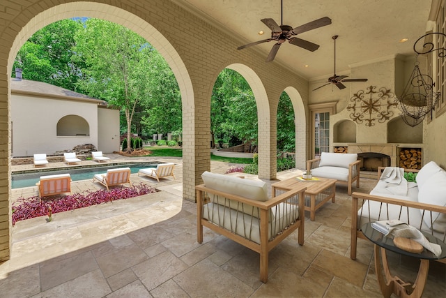 view of patio / terrace featuring ceiling fan and an outdoor living space