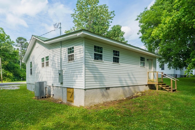 view of property exterior featuring a yard and central air condition unit