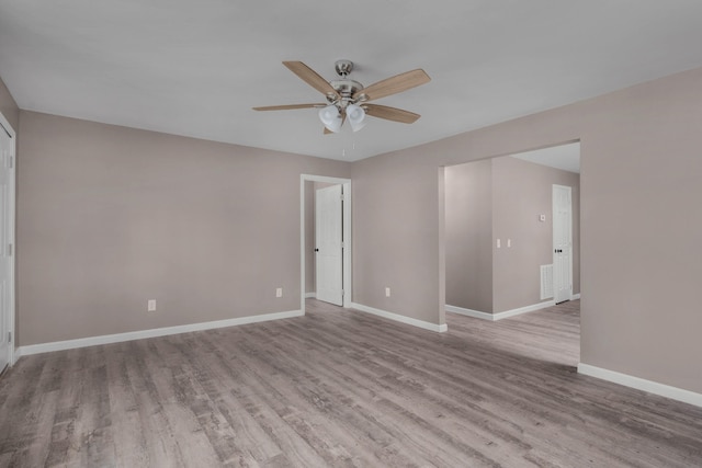 unfurnished room with ceiling fan and dark hardwood / wood-style floors