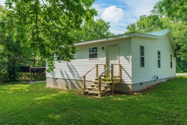 back of house with a yard