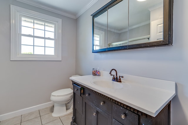 bathroom featuring ornamental molding, tile flooring, toilet, and vanity with extensive cabinet space