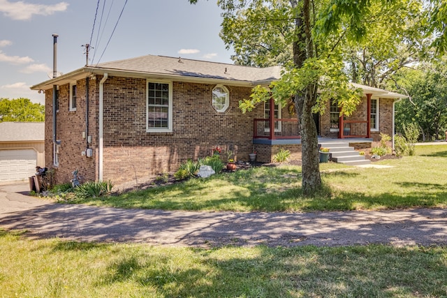 view of front of property with a front yard and a porch