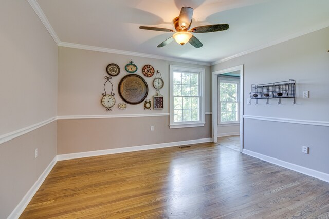 spare room featuring crown molding, ceiling fan, and light hardwood / wood-style flooring