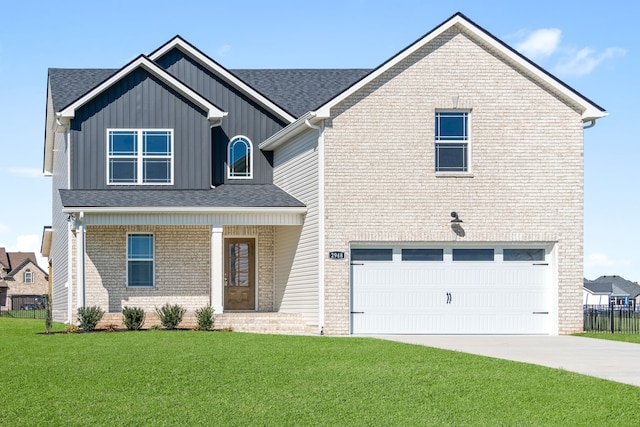 view of front of home with a front lawn and a garage