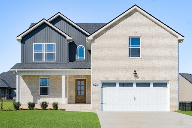 view of front facade with a front yard and a garage