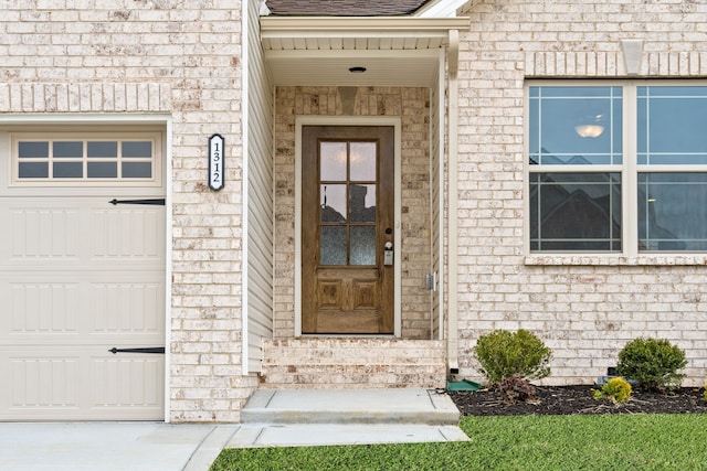 doorway to property featuring a garage