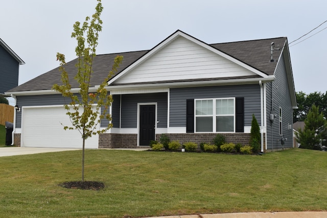 view of front of home featuring a front lawn and a garage