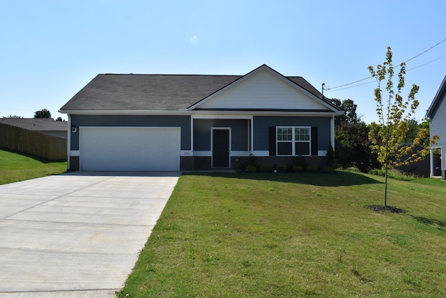 view of front facade with a front yard and a garage