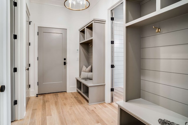 mudroom with light hardwood / wood-style floors