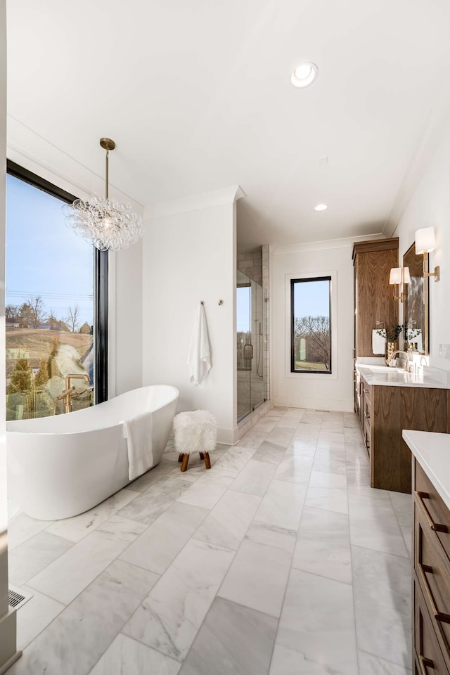 bathroom featuring vanity, plus walk in shower, a notable chandelier, tile flooring, and crown molding