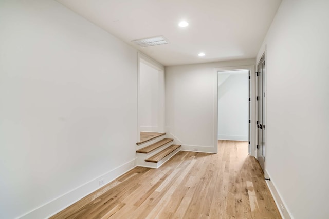 hall with light hardwood / wood-style flooring