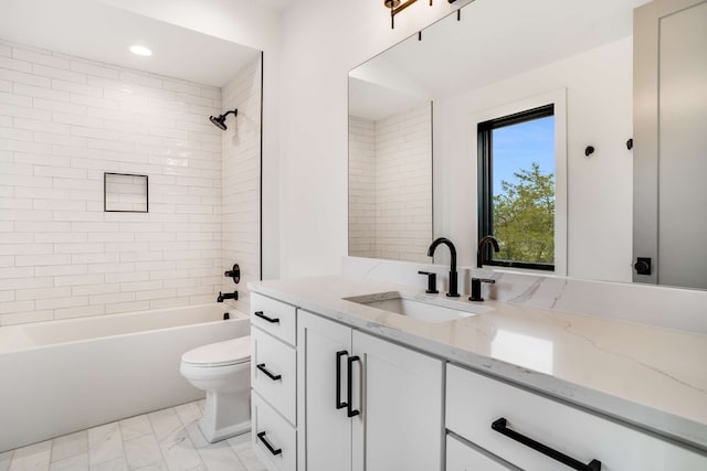 full bathroom with tiled shower / bath, toilet, tile flooring, and vanity