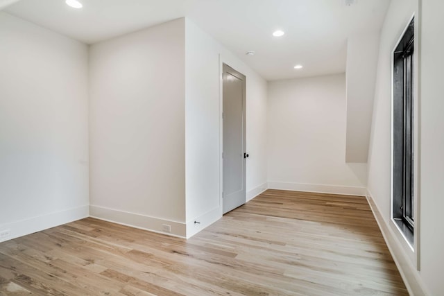 spare room featuring light hardwood / wood-style floors