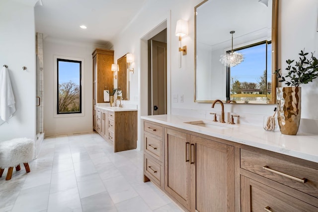 bathroom with an inviting chandelier, tile flooring, and dual bowl vanity