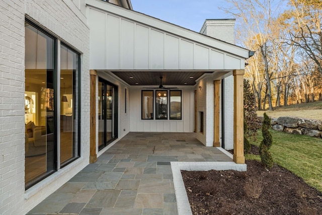 exterior space featuring ceiling fan