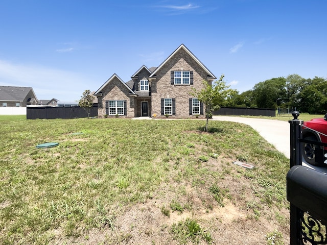 view of front of home with a front lawn