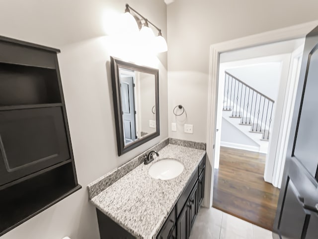 bathroom with vanity and wood-type flooring