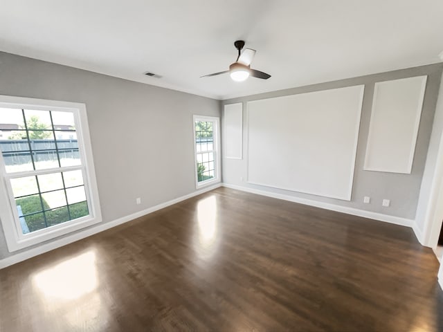 unfurnished room featuring ceiling fan and dark hardwood / wood-style floors