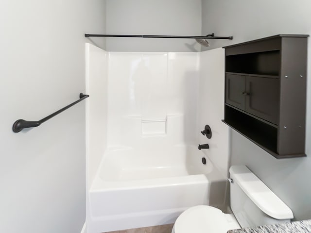 bathroom with shower / tub combination and toilet