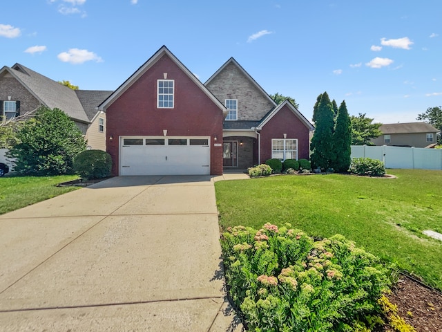 view of front property featuring a front lawn and a garage