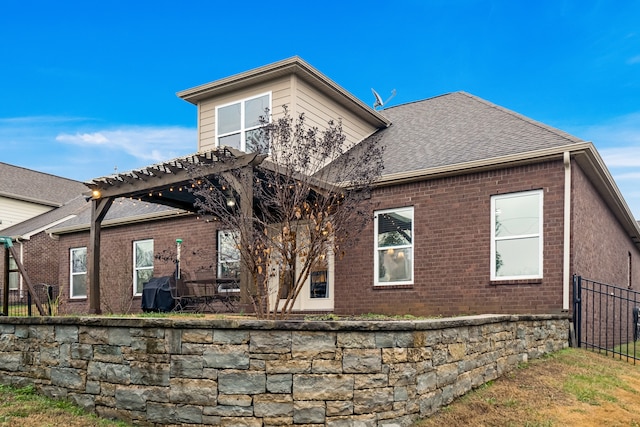 rear view of house with a pergola