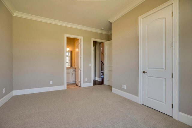 unfurnished bedroom with connected bathroom, light carpet, and ornamental molding