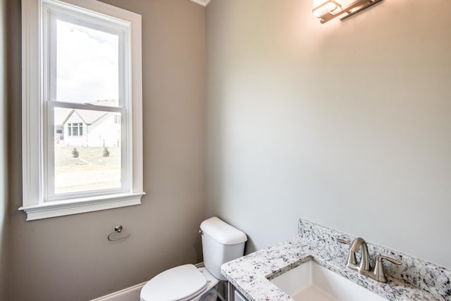 bathroom featuring toilet and vanity