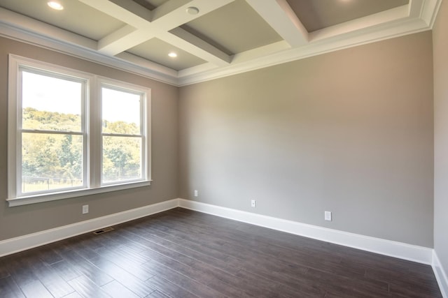 empty room featuring coffered ceiling, plenty of natural light, and dark hardwood / wood-style flooring