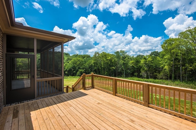 wooden deck featuring a sunroom