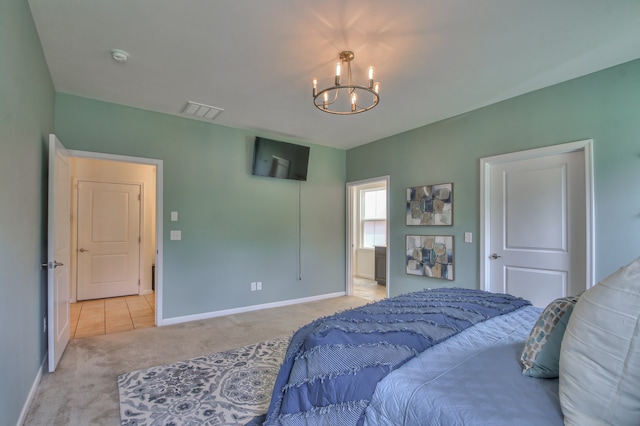 bedroom featuring a chandelier and light colored carpet