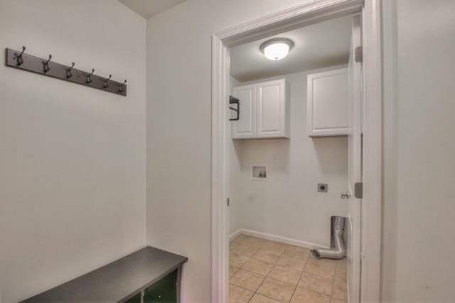 laundry area with hookup for a washing machine, cabinets, electric dryer hookup, and light tile floors