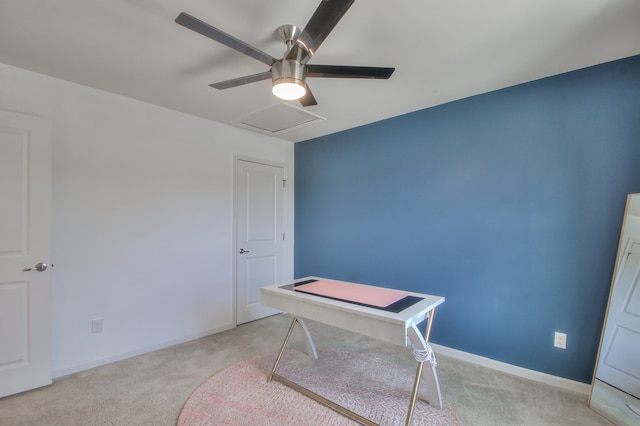 office space featuring light colored carpet and ceiling fan