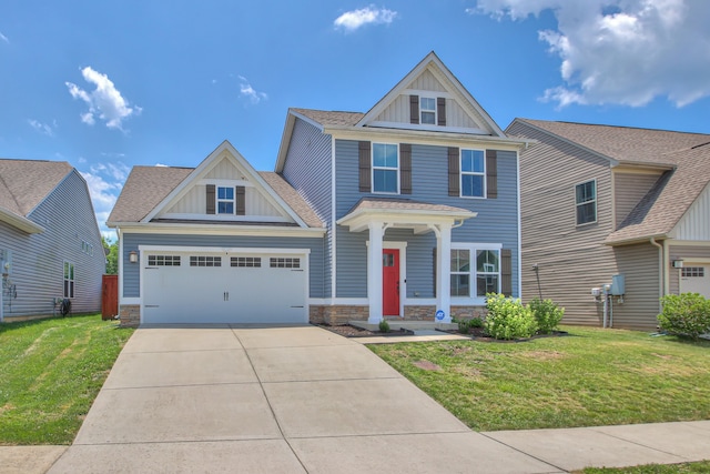 craftsman house featuring a front lawn and a garage