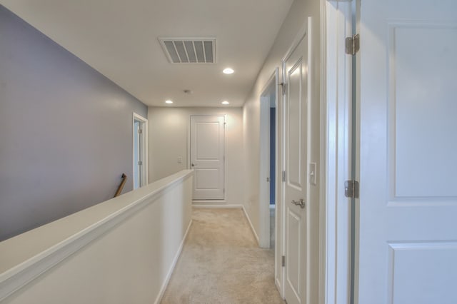 hallway with light carpet