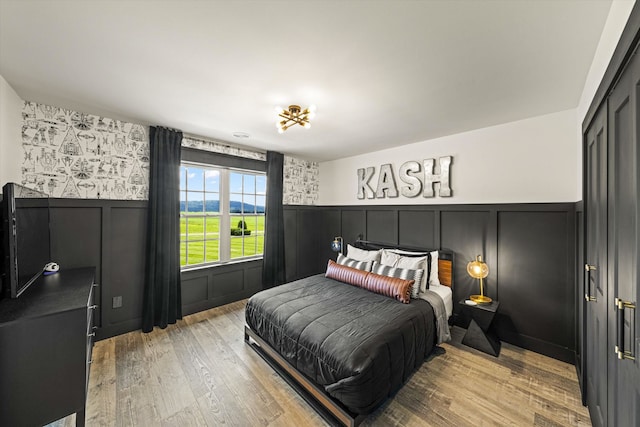 bedroom with light hardwood / wood-style floors